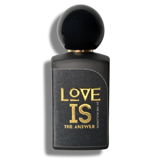 Frasco del perfume "Love Is the Answer" de Mr. Waldron, en elegante diseño negro con letras doradas y tapón esférico. Fragancia nicho exclusiva en Perfumería Sanchotena.