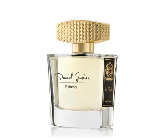 Frasco de perfume ‘Le Musk Eau de Parfum’ de Daniel Josier, con diseño transparente, líquido claro, tapón dorado texturizado y detalles sofisticados, resaltando un aroma envolvente y almizclado.