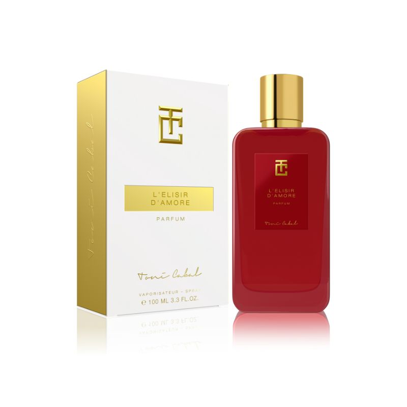 Perfume ‘L’Elisir d’Amore Parfum’ de Toni Cabal, en un frasco rojo con tapón dorado, acompañado de su caja blanca con detalles dorados, destacando un aroma romántico y seductor.