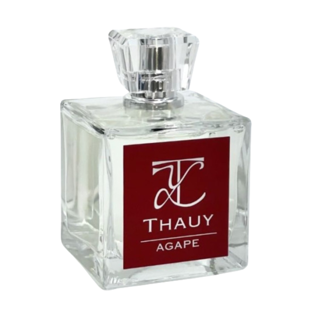 "Frasco del perfume Ágape de THAUY con diseño minimalista, fragancia floral frutal con almendra y vainilla que evoca amor incondicional"