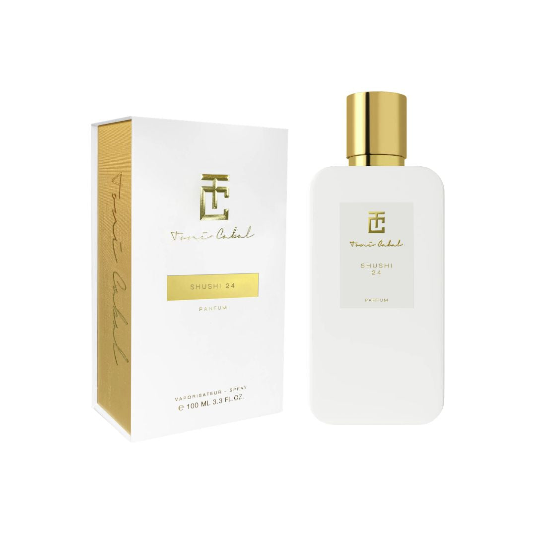 Caja y frasco del perfume Toni Cabal Shushi 24 Parfum con presentación sofisticada en blanco y dorado.