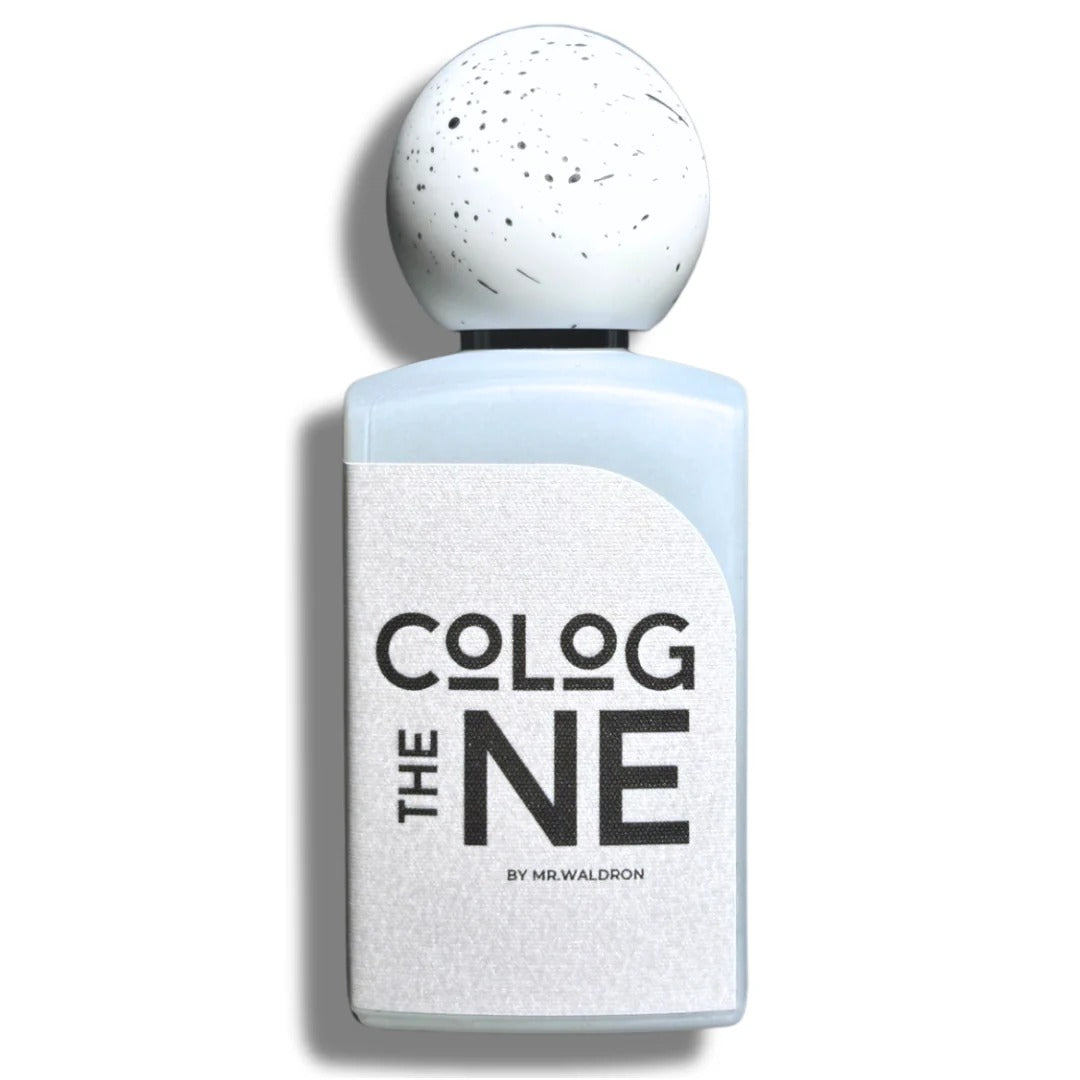 Frasco del perfume "The Cologne" de Mr. Waldron, en diseño blanco con tipografía negra y tapón esférico moteado. Perfume de autor exclusivo en Perfumería Sanchotena.
