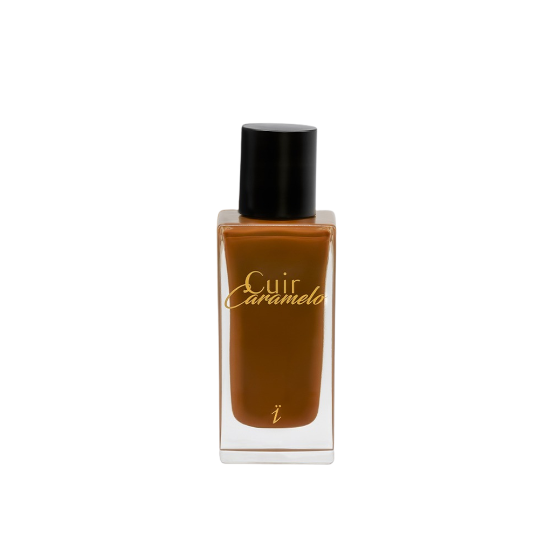 Perfume Cuir Caramelo de Yzkine en frasco ámbar con tapón negro, fragancia cálida y envolvente.