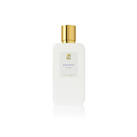 Frasco del perfume Santorini de Toni Cabal, diseño minimalista con tapón dorado