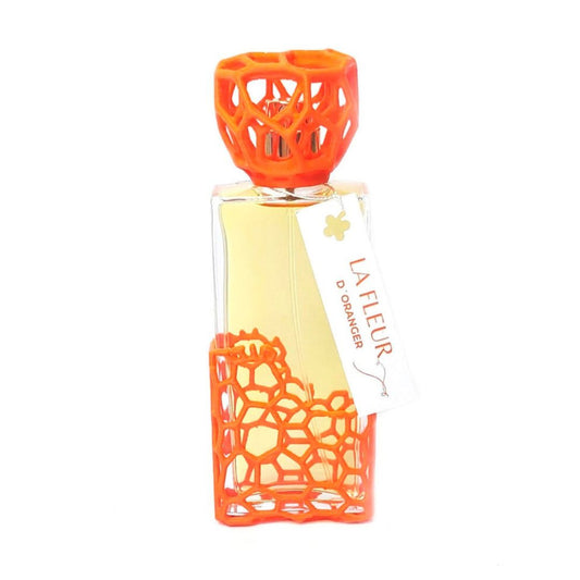 Frasco de Fleur d'Oranger, Sid Martens, perfume floral cítrico, aroma fresco con acabado naranja calado.