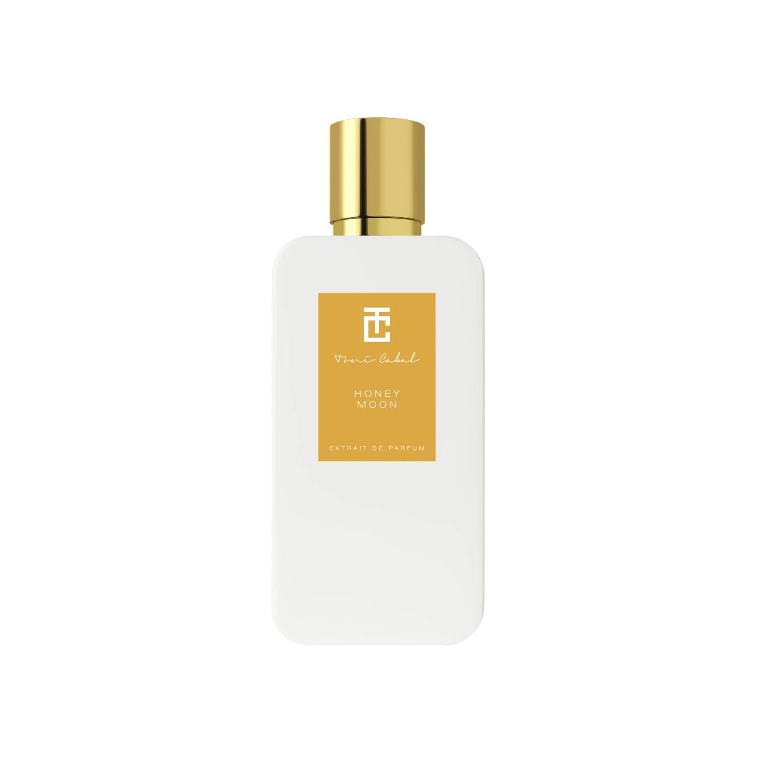 Perfume Toni Cabal Honey Moon Extrait de Parfum en frasco blanco mate con tapón dorado sobre fondo claro.